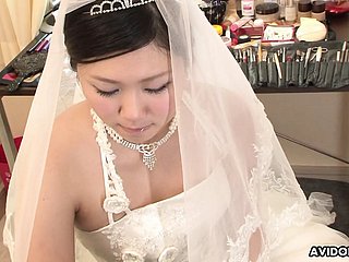 Brunette Emi Koizumi fucked beyond bridal dress uncensored.